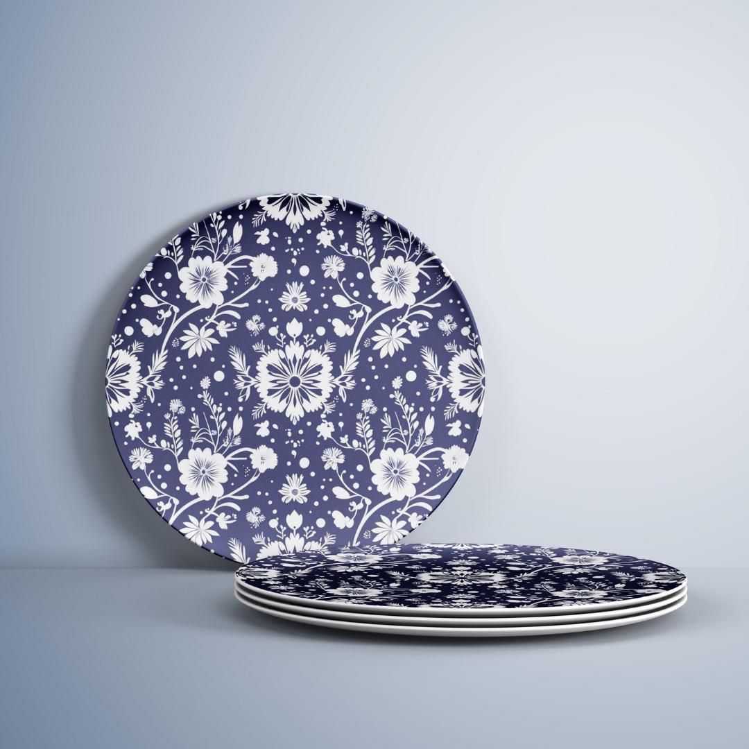 Navy and white round decorative plate featuring a handcrafted floral design with delicate botanical patterns, perfect for dining or kitchen decor.
